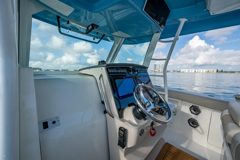  Yacht Photos Pics 2024 Boston Whaler 380 Outrage helm with modern controls and ocean view.