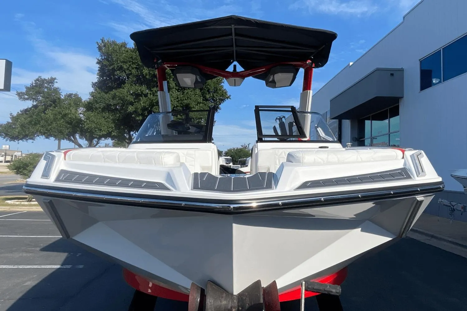 2023 Nautique Super Air Nautique G25 Paragon boat, front view, docked outdoors.