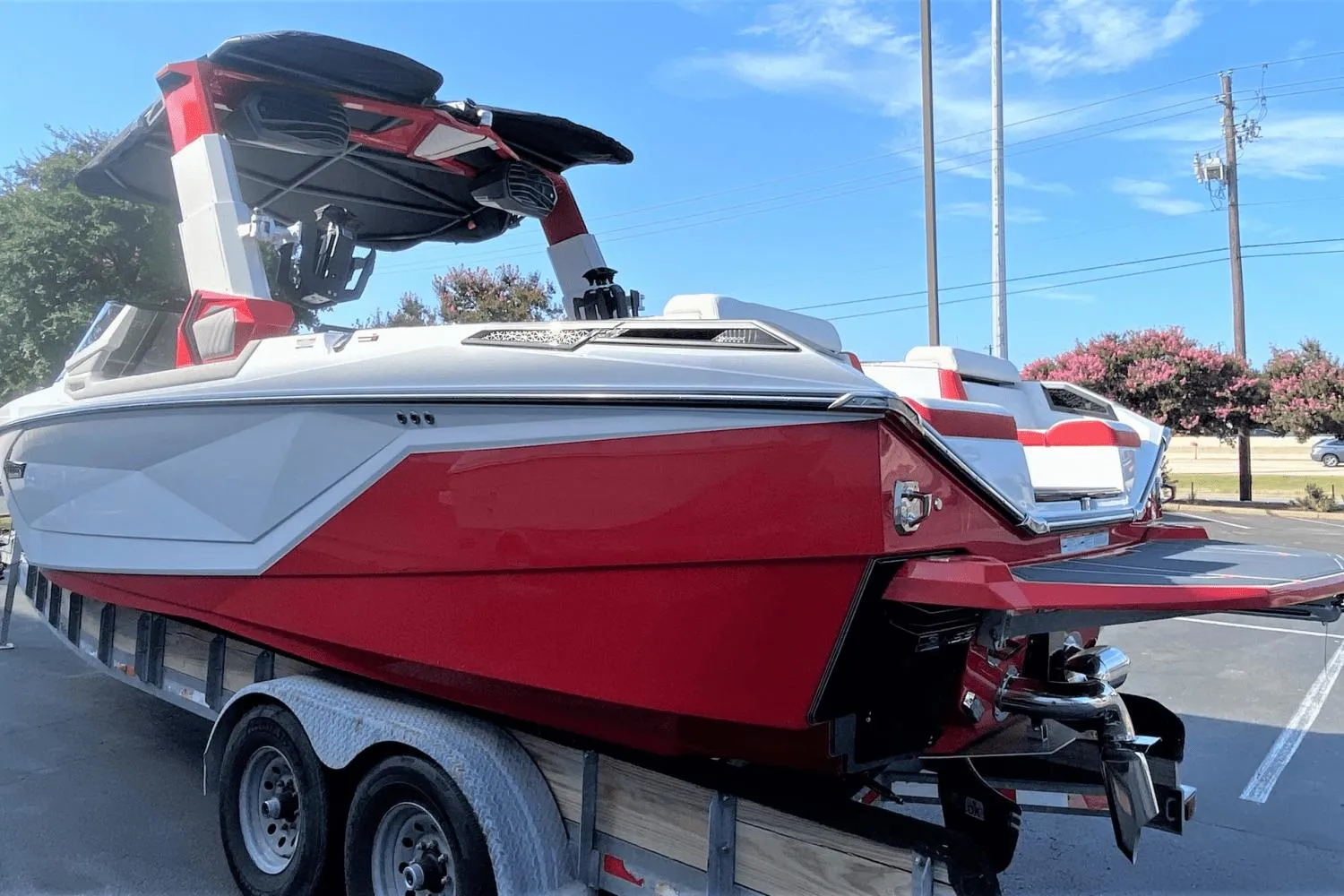 2023 Nautique Super Air Nautique G25 Paragon boat on trailer, red and white exterior.