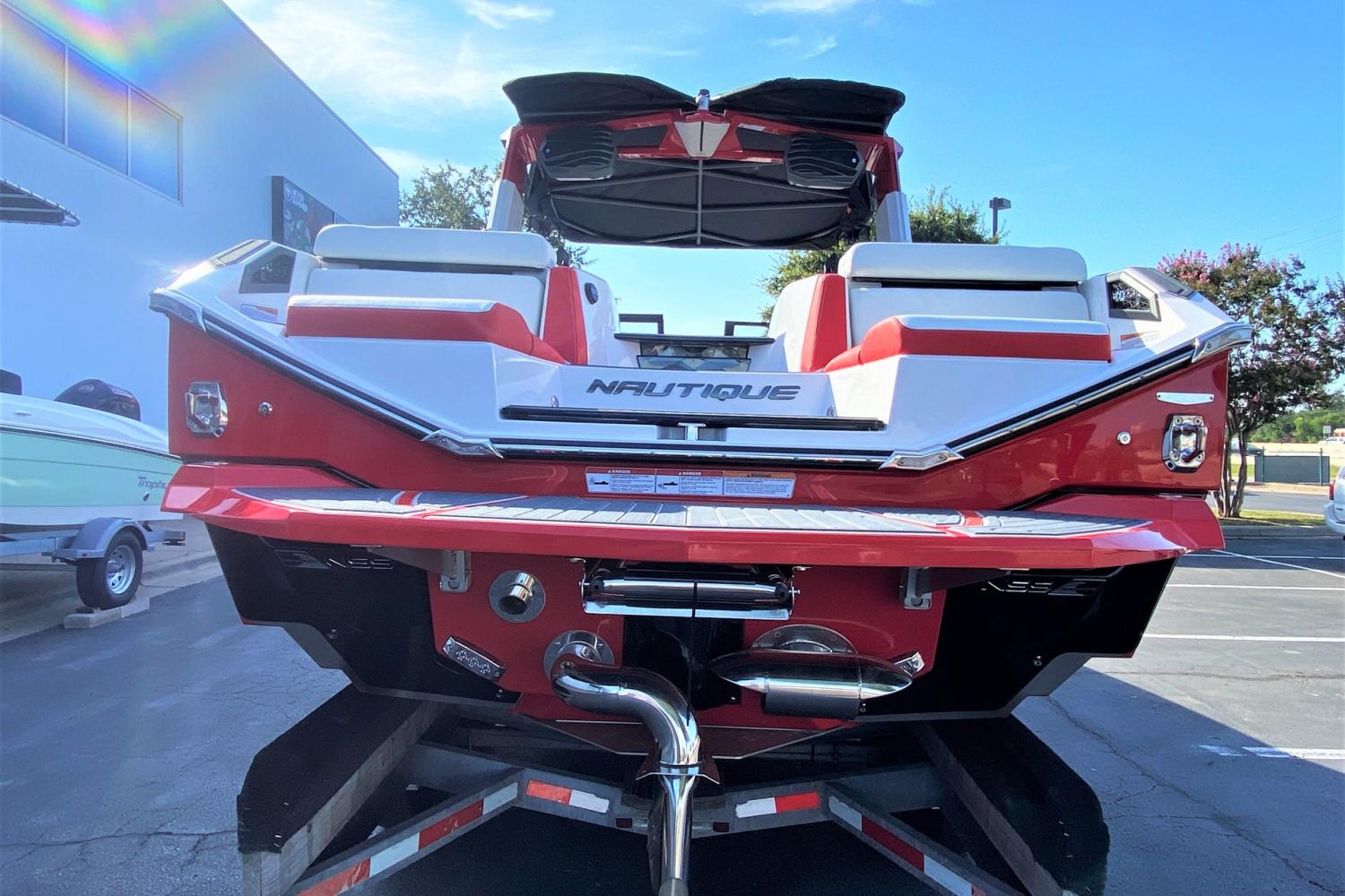 2023 Nautique Super Air Nautique G25 Paragon boat rear view in red and white.