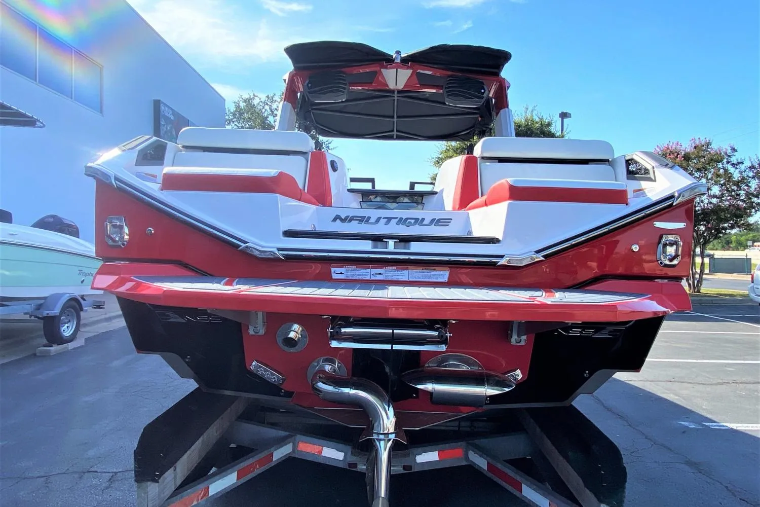 2023 Nautique Super Air Nautique G25 Paragon boat rear view in red and white.