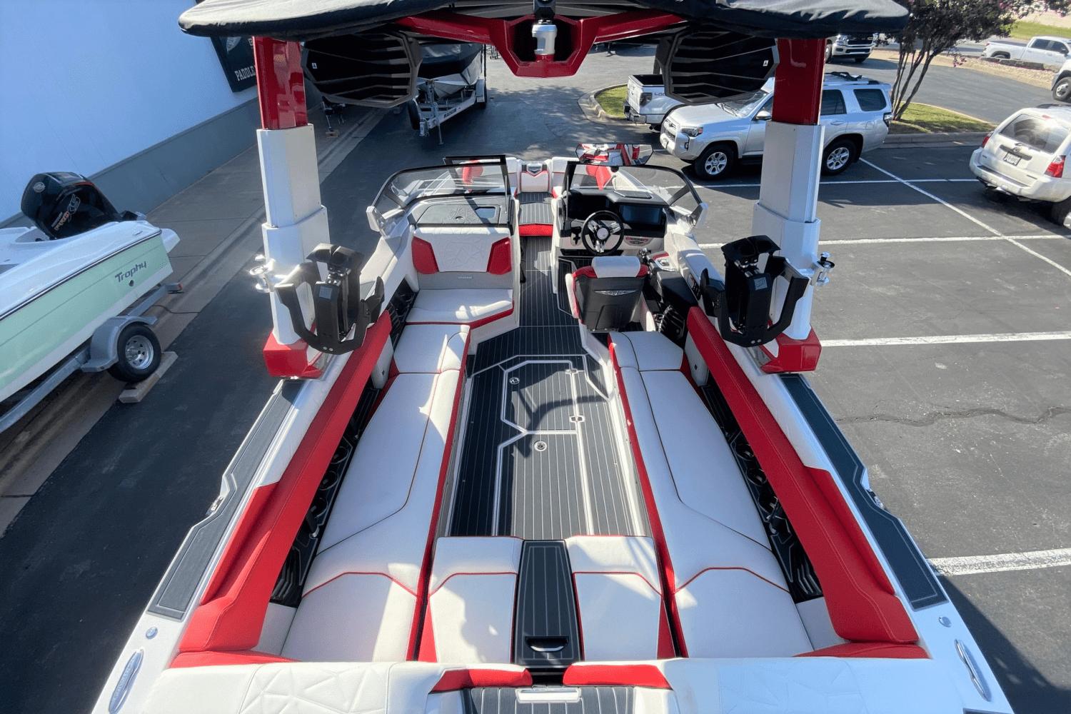 2023 Nautique Super Air Nautique G25 Paragon interior with red and white seating.