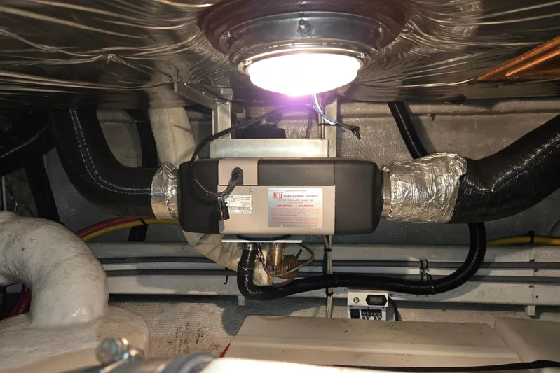 Laissez Faire Yacht Photos Pics Engine room of 1993 Ocean Alexander 423 Classicco yacht with visible wiring and components.