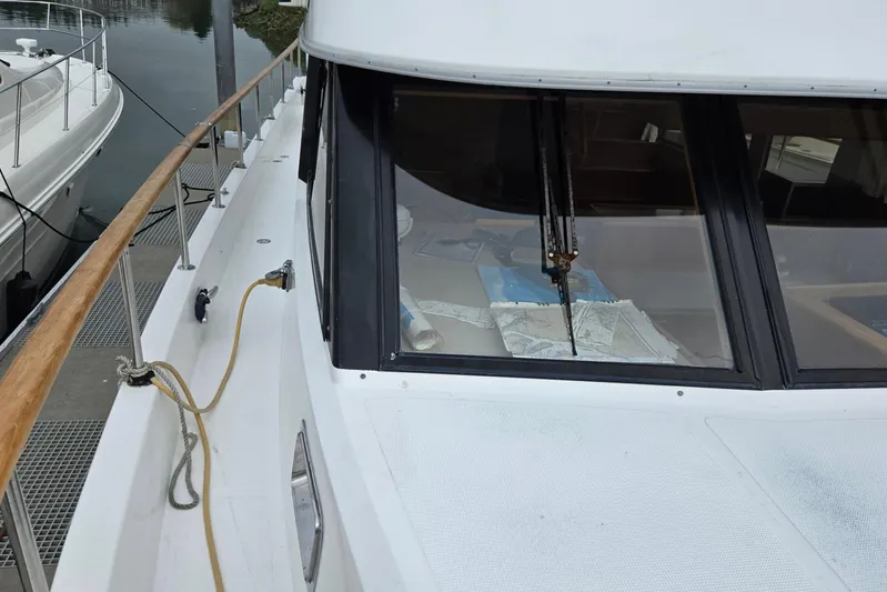 Laissez Faire Yacht Photos Pics 1993 Ocean Alexander 423 Classicco yacht docked, showing deck and cabin windows.