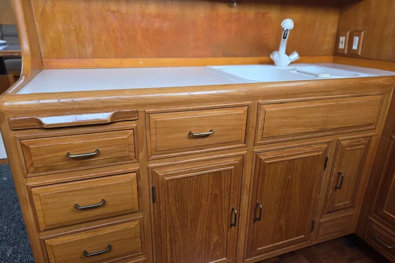 Laissez Faire Yacht Photos Pics Wooden cabinetry and sink in 1993 Ocean Alexander 423 Classicco yacht interior.