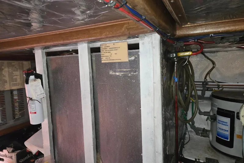 Laissez Faire Yacht Photos Pics Engine room of 1993 Ocean Alexander 423 Classicco with fire extinguisher and wiring.