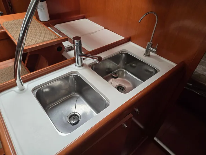 Surprise Yacht Photos Pics Galley sink area in 2007 Beneteau 49 yacht with dual stainless steel basins.