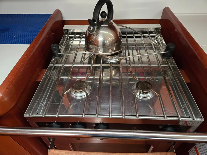 Surprise Yacht Photos Pics Stainless steel stove with kettle on Beneteau 49 yacht, 2007 model.