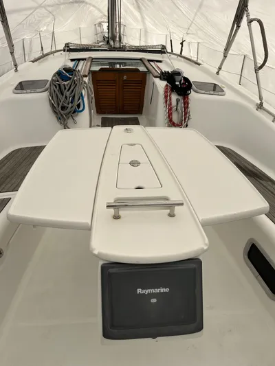 Surprise Yacht Photos Pics 2007 Beneteau 49 yacht cockpit with Raymarine equipment and neatly arranged ropes.