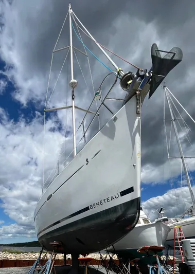 Surprise Yacht Photos Pics 2007 Beneteau 49 sailboat on dry dock under cloudy sky.
