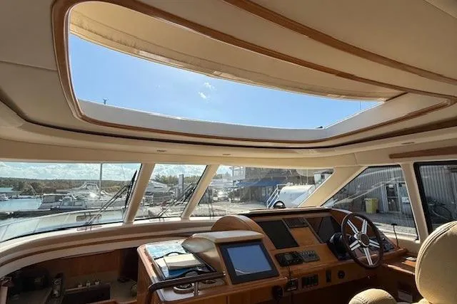 Jesse James Yacht Photos Pics Interior view of 2011 Tiara Yachts 5800 Sovran with sunroof and helm station.