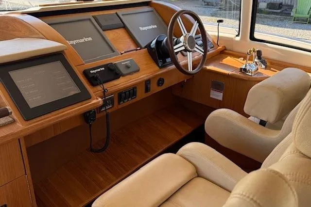 Jesse James Yacht Photos Pics Interior helm of 2011 Tiara Yachts 5800 Sovran with modern navigation equipment.