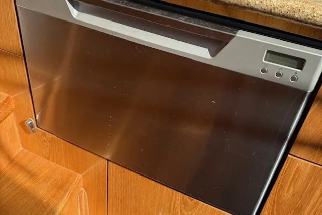 Jesse James Yacht Photos Pics Stainless steel dishwasher in 2011 Tiara Yachts 5800 Sovran kitchen area.