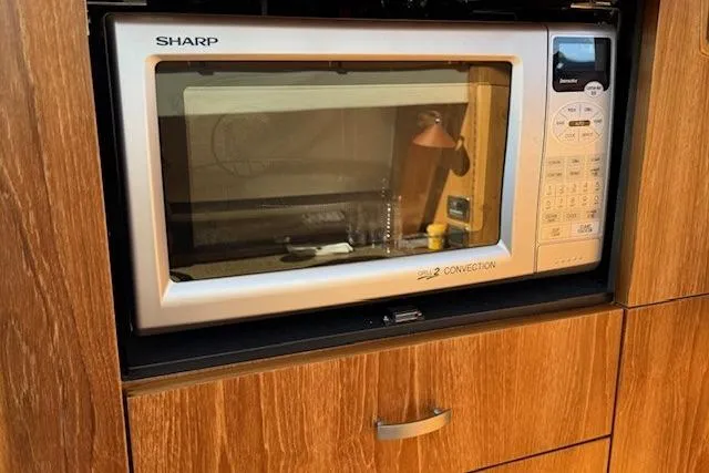 Jesse James Yacht Photos Pics Sharp microwave in 2011 Tiara Yachts 5800 Sovran kitchen area.