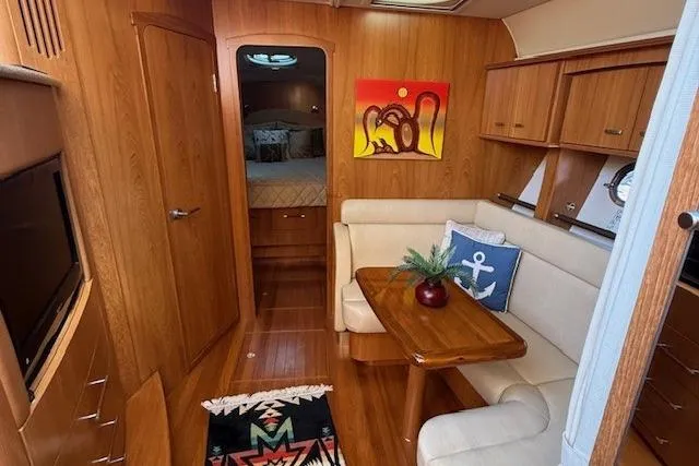 Jesse James Yacht Photos Pics Interior of 2011 Tiara Yachts 5800 Sovran with cozy seating and nautical decor.