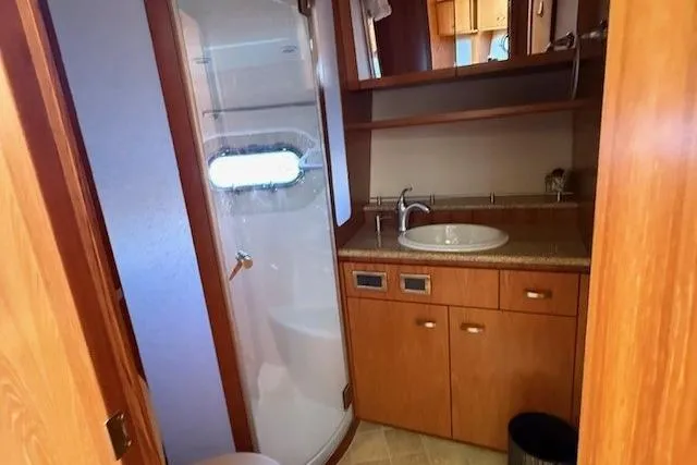 Jesse James Yacht Photos Pics Luxurious bathroom in 2011 Tiara Yachts 5800 Sovran with shower and sink.