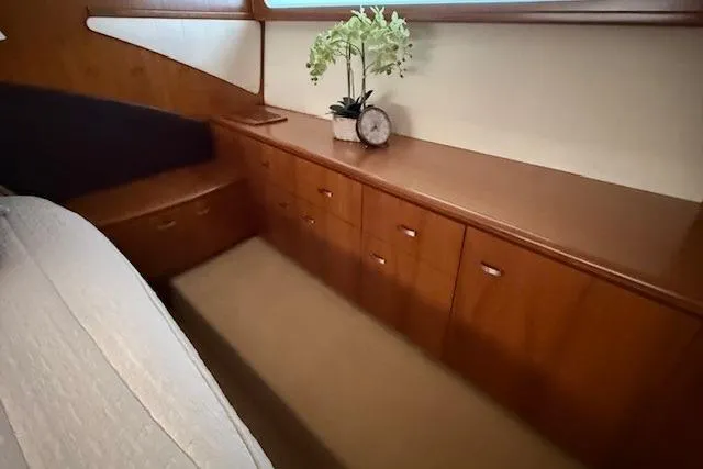 Jesse James Yacht Photos Pics Luxurious cabin interior of 2011 Tiara Yachts 5800 Sovran with elegant wood cabinetry.