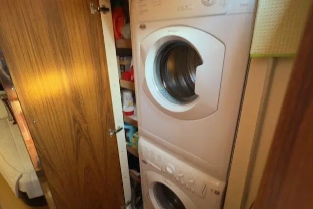 Jesse James Yacht Photos Pics Stacked washer and dryer in 2011 Tiara Yachts 5800 Sovran interior.