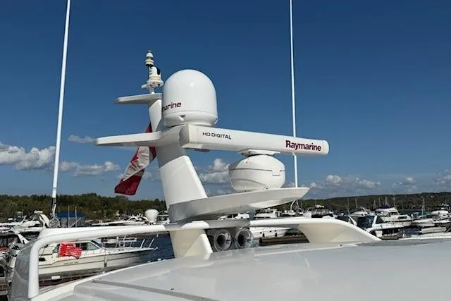 Jesse James Yacht Photos Pics Radar equipment on 2011 Tiara Yachts 5800 Sovran, docked in a marina.
