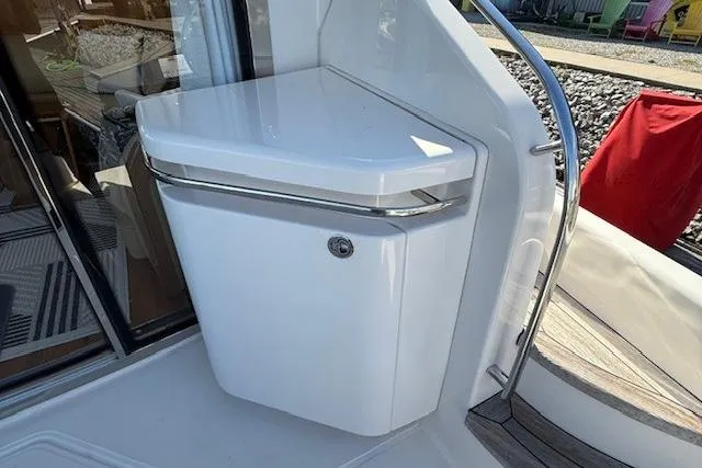 Jesse James Yacht Photos Pics 2011 Tiara Yachts 5800 Sovran deck with sleek white cabinetry and stainless steel accents.