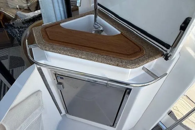 Jesse James Yacht Photos Pics 2011 Tiara Yachts 5800 Sovran yacht kitchenette with sink and mini fridge.