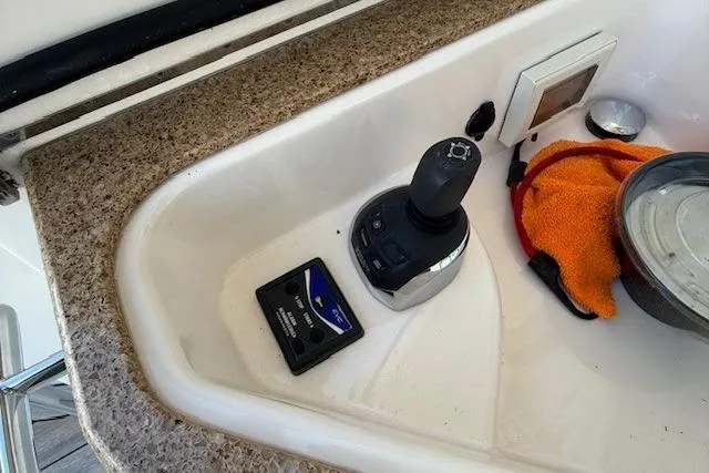 Jesse James Yacht Photos Pics Control panel of a 2011 Tiara Yachts 5800 Sovran with joystick and electronic display.