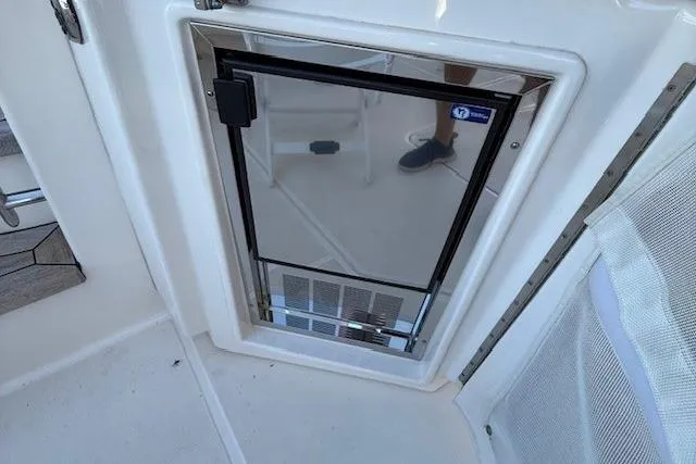 Jesse James Yacht Photos Pics Built-in refrigerator on 2011 Tiara Yachts 5800 Sovran deck.