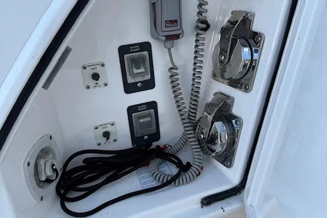Jesse James Yacht Photos Pics Control panel of a 2011 Tiara Yachts 5800 Sovran with switches and coiled cables.