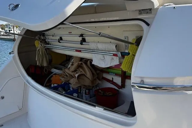 Jesse James Yacht Photos Pics Storage compartment of 2011 Tiara Yachts 5800 Sovran, filled with boating equipment.