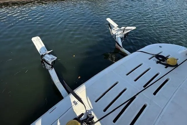 Jesse James Yacht Photos Pics 2011 Tiara Yachts 5800 Sovran swim platform with davit system in water.