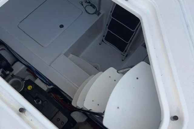 Jesse James Yacht Photos Pics 2011 Tiara Yachts 5800 Sovran engine compartment with visible components and access ladder.