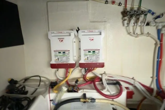 Jesse James Yacht Photos Pics Engine room of 2011 Tiara Yachts 5800 Sovran with electrical components and wiring.