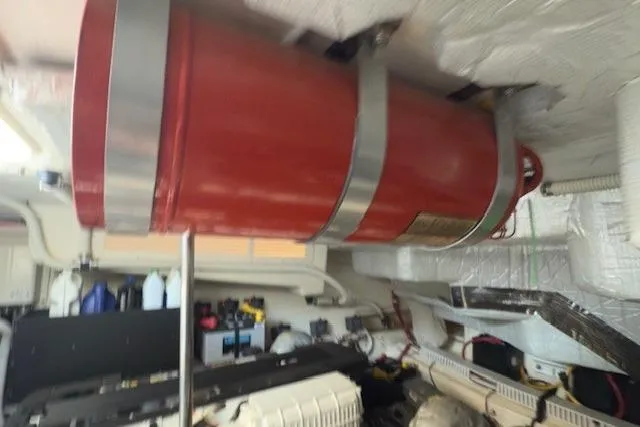 Jesse James Yacht Photos Pics Engine room of 2011 Tiara Yachts 5800 Sovran with red cylindrical component.