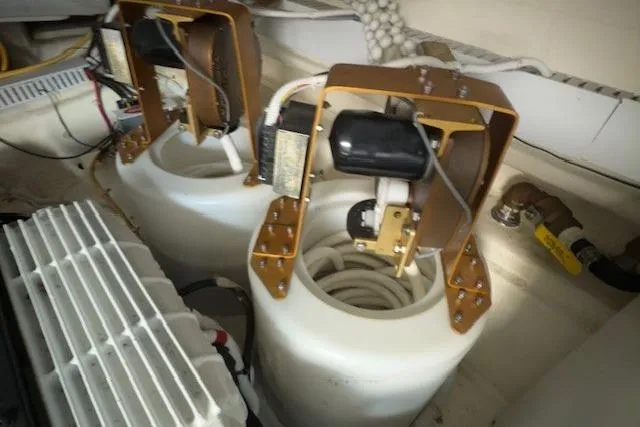 Jesse James Yacht Photos Pics Engine room components of 2011 Tiara Yachts 5800 Sovran, featuring dual tanks and equipment.