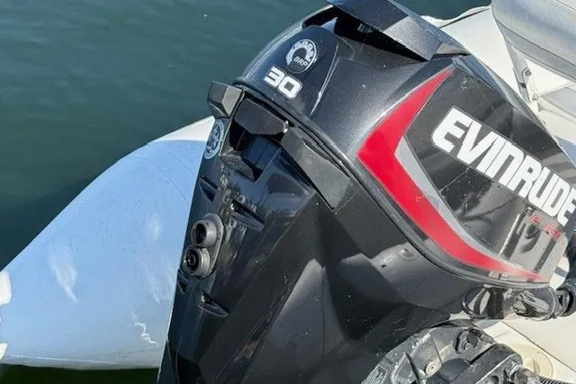 Jesse James Yacht Photos Pics Evinrude 30 outboard motor on a 2011 Tiara Yachts 5800 Sovran.