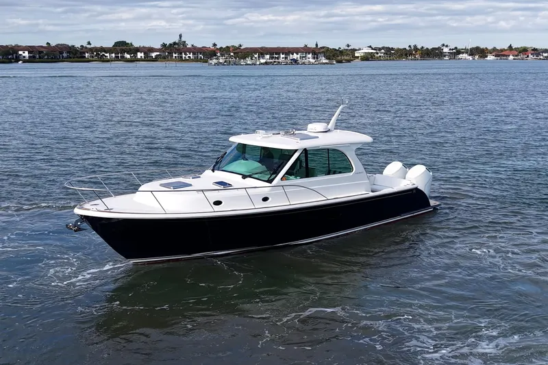 Catnap Yacht Photos Pics 2023 Hinckley Sport Boat 40 X cruising on calm waters.