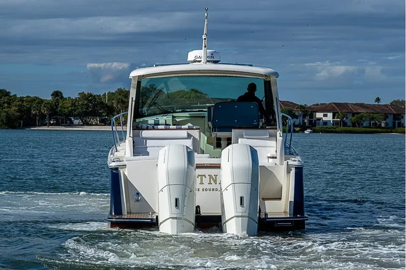 Catnap Yacht Photos Pics 2023 Hinckley Sport Boat 40 X cruising on a serene waterway.