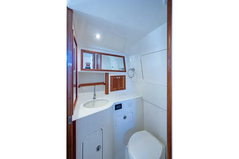 Catnap Yacht Photos Pics 2023 Hinckley Sport Boat 40 X bathroom with modern fixtures and wooden accents.