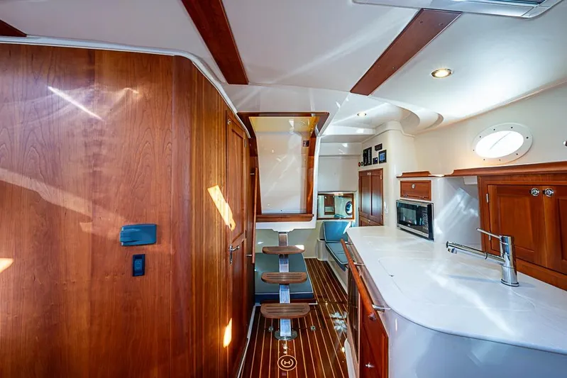 Catnap Yacht Photos Pics Interior of 2023 Hinckley Sport Boat 40 X with elegant wood finishes and modern amenities.