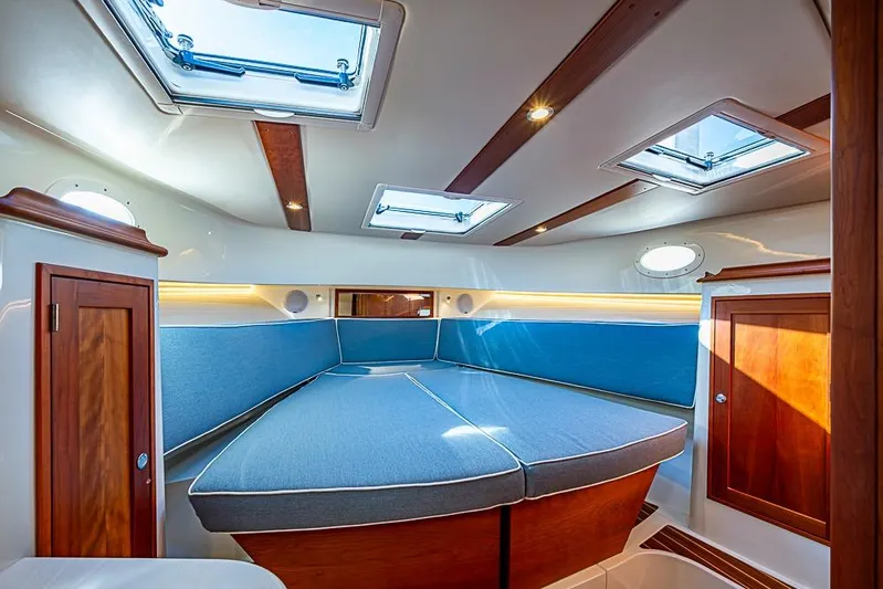Catnap Yacht Photos Pics Interior of 2023 Hinckley Sport Boat 40 X, featuring a cozy cabin with skylights.