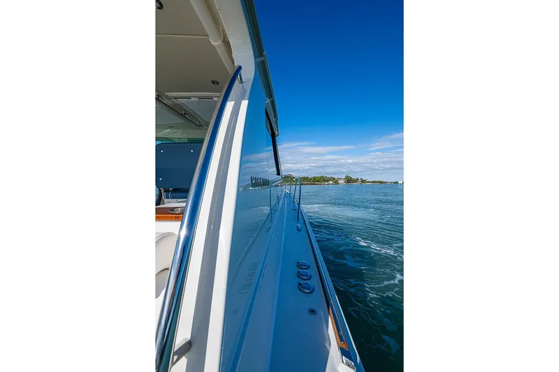 Catnap Yacht Photos Pics 2023 Hinckley Sport Boat 40 X cruising on a sunny day, side view.