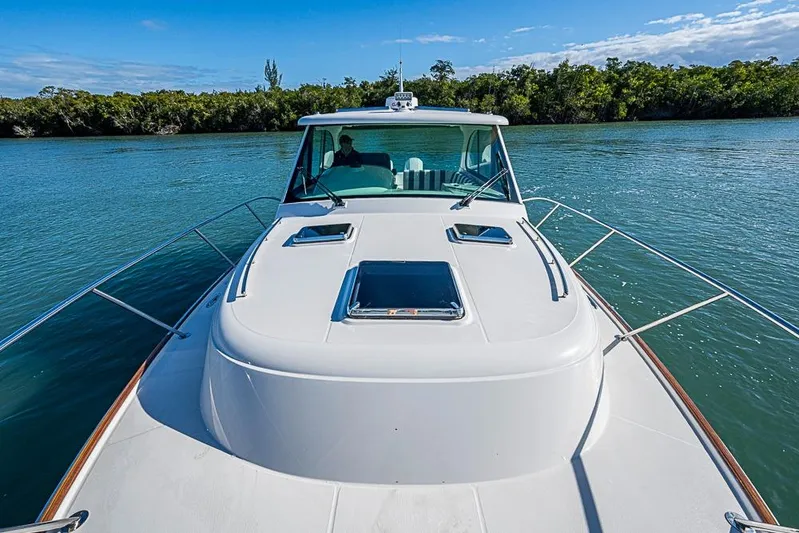 Catnap Yacht Photos Pics 2023 Hinckley Sport Boat 40 X cruising on a serene waterway.