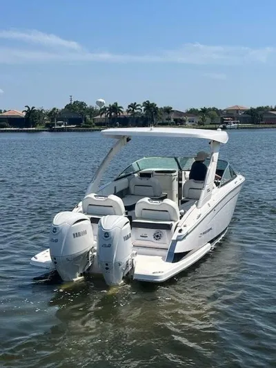  Yacht Photos Pics 2024 Regal 29 boat with twin Yamaha engines on a sunny day.