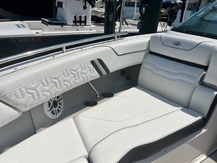  Yacht Photos Pics Luxurious seating on 2024 Regal 29 boat with white upholstery and modern design.