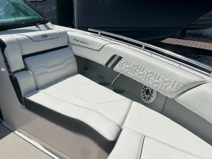  Yacht Photos Pics 2024 Regal 29 boat interior with white leather seating and modern design.