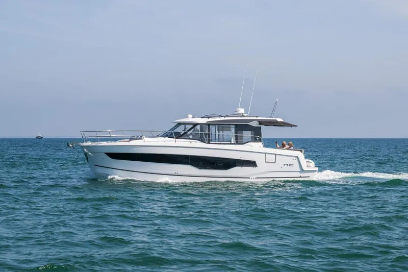  Yacht Photos Pics 2026 Jeanneau NC 1295 Weekender cruising on open water.