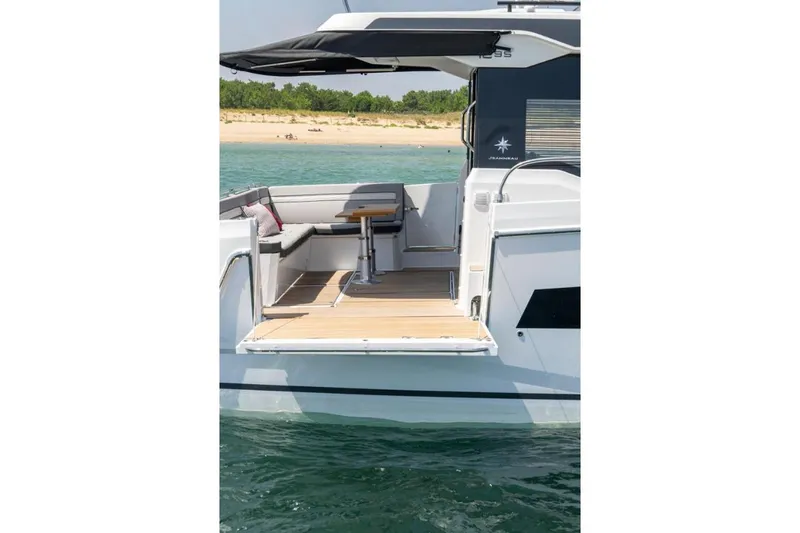  Yacht Photos Pics 2026 Jeanneau NC 1295 Weekender boat with open deck and seating area.