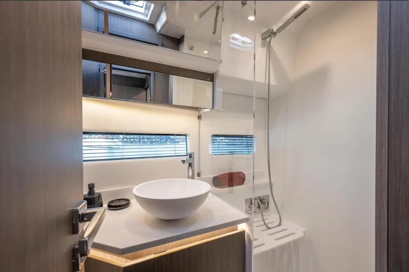  Yacht Photos Pics Modern bathroom interior of 2026 Jeanneau NC 1295 Weekender yacht.