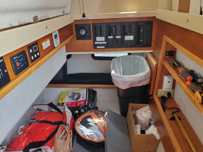  Yacht Photos Pics Interior of 2016 Cutwater 30 Command Bridge with control panels and storage.