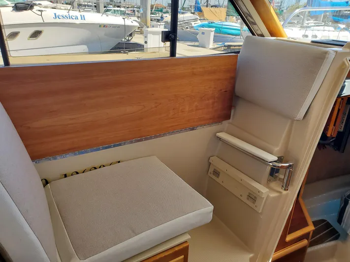  Yacht Photos Pics Interior seating of 2016 Cutwater 30 Command Bridge boat with marina view.